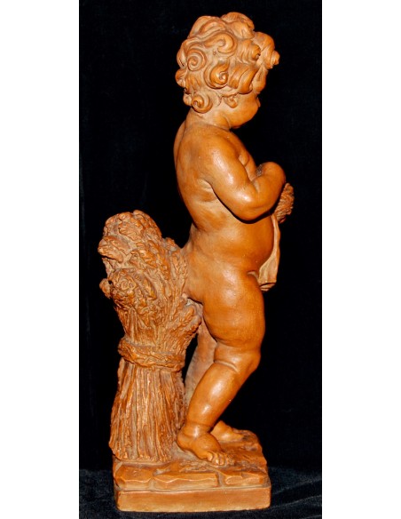 Putto jugando con aves, terracota de principio del siglo XX.