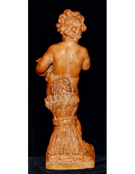 Putto jugando con aves, terracota de principio del siglo XX.