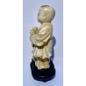 Carved ivory sculpture, Child with glasses