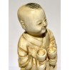 Carved ivory sculpture, Child with glasses