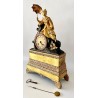 French table pendulum clock, in gilt bronze and green patina, early 19th century empire period.