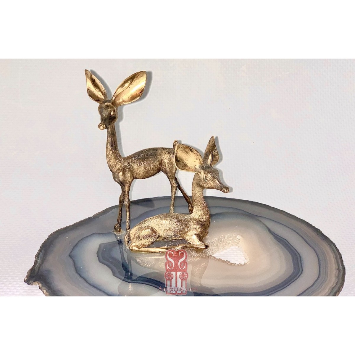 Pareja de ciervos de plata 800 dorada.