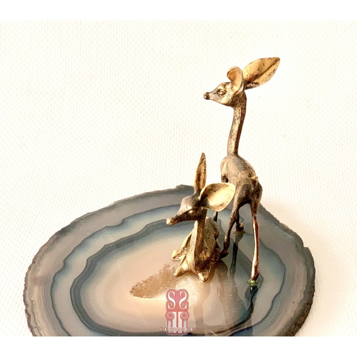 Pareja de ciervos de plata 800 dorada.