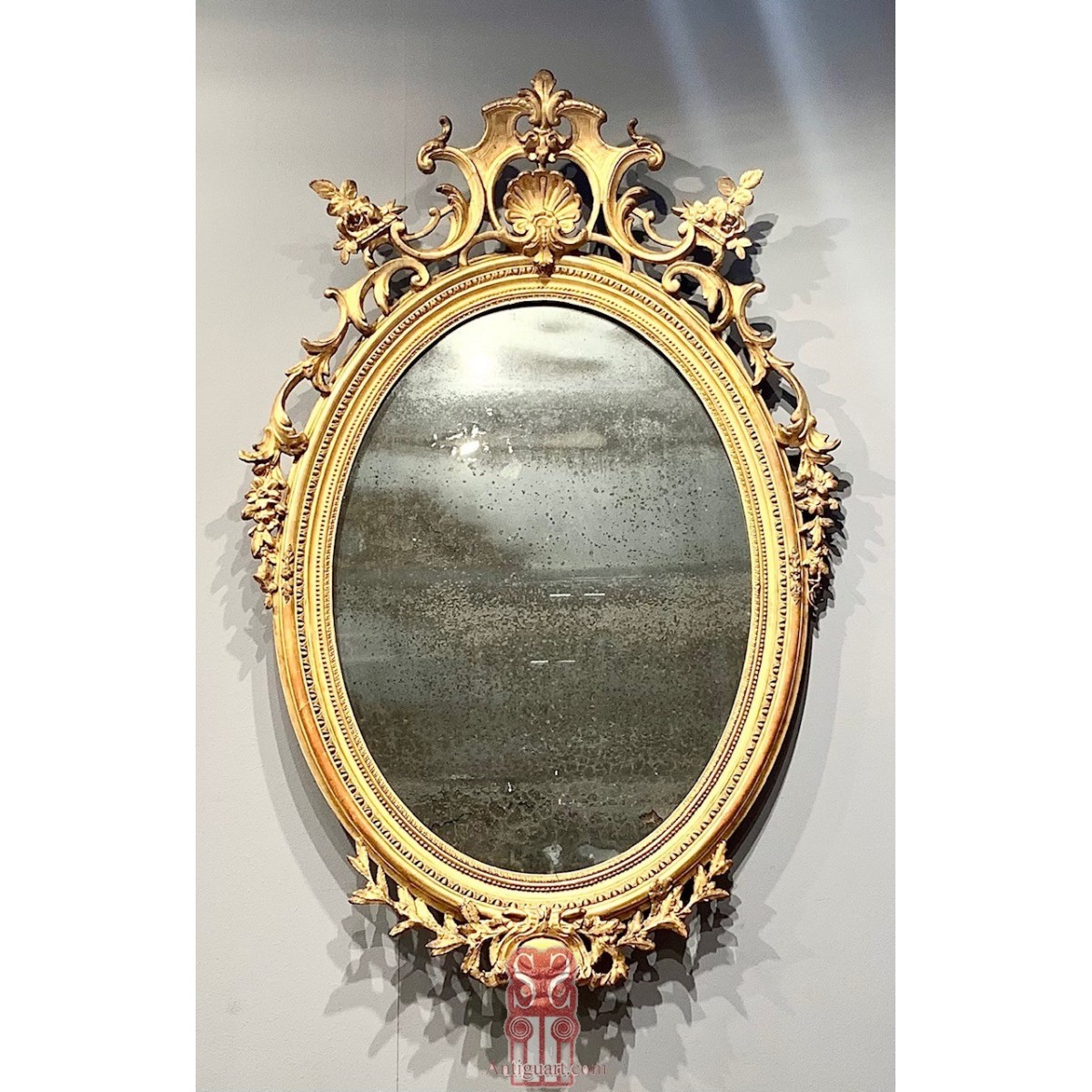 19th century oval gilded mirror