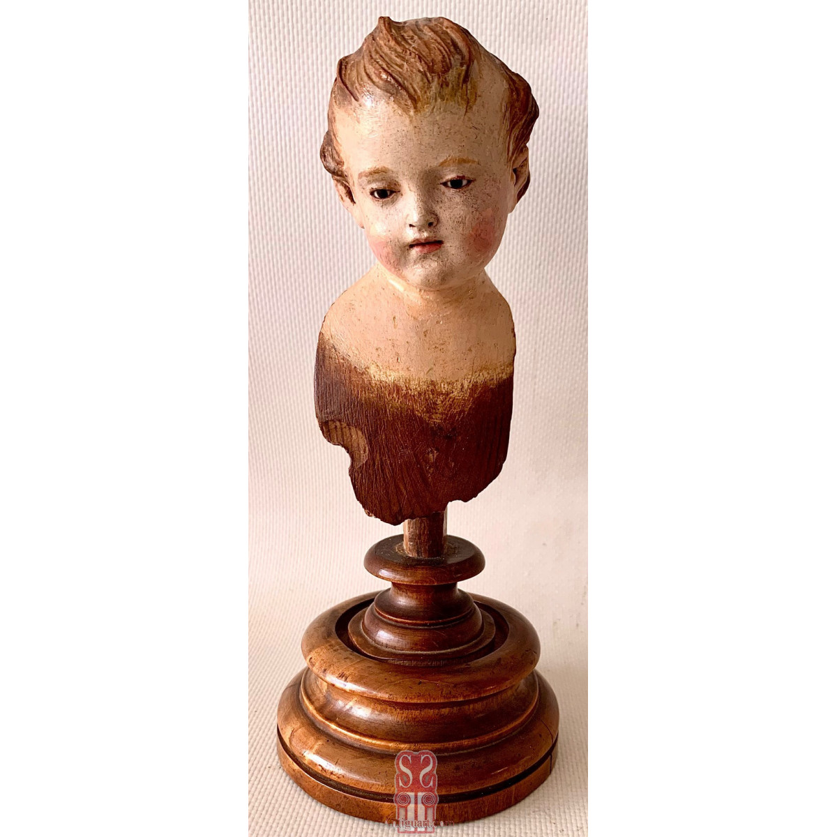 Carved and polychromed head of a child 18th 