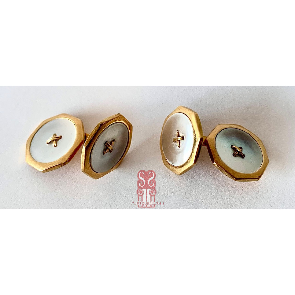 Pareja de gemelos de oro de 18K