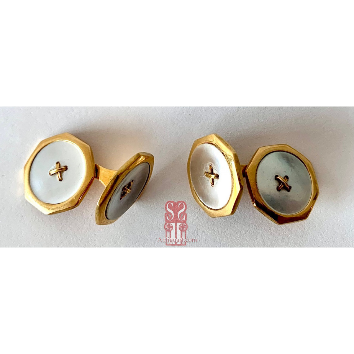 Pareja de gemelos de oro de 18K