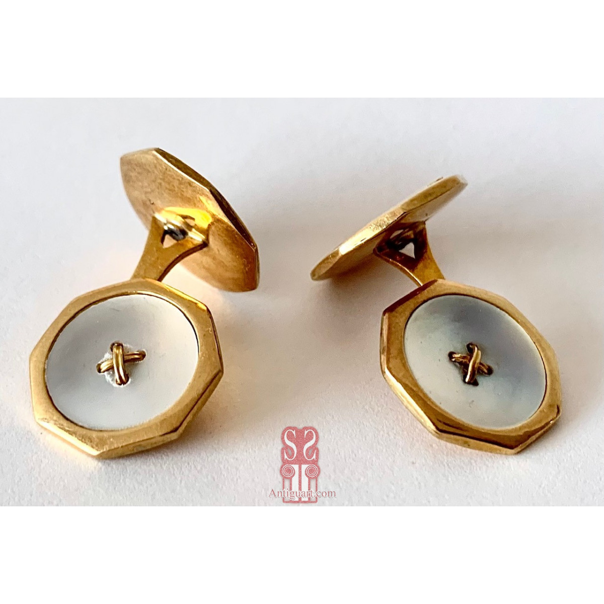 Pareja de gemelos de oro de 18K