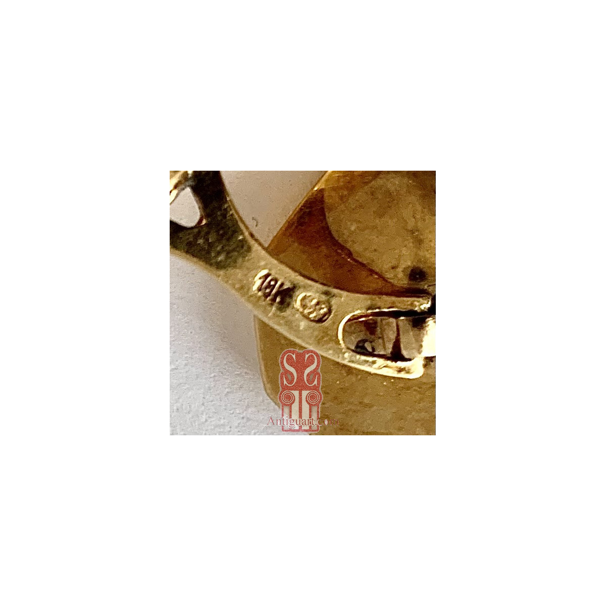 Pareja de gemelos de oro de 18K