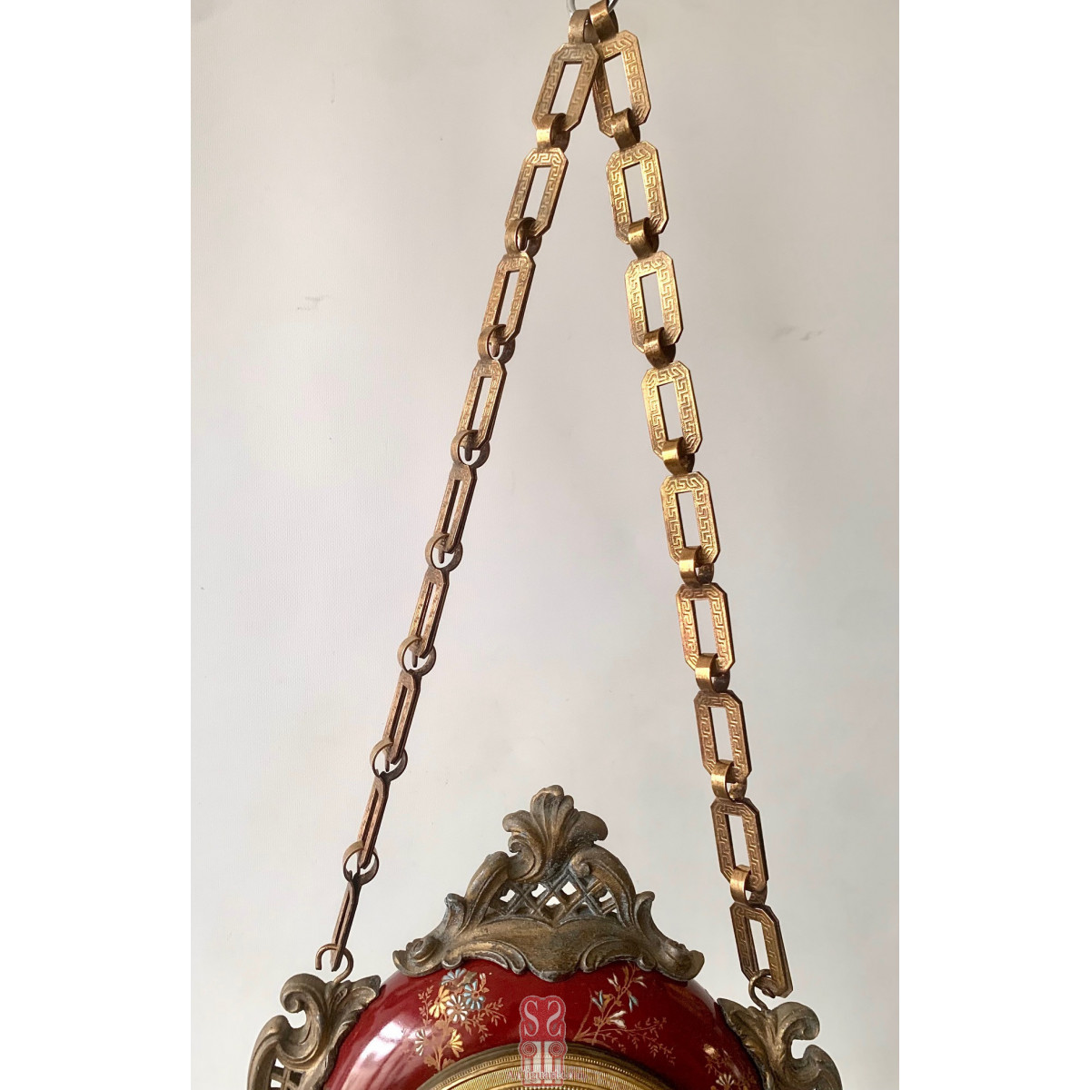 Reloj colgante de doble esfera de principios del Siglo XX.