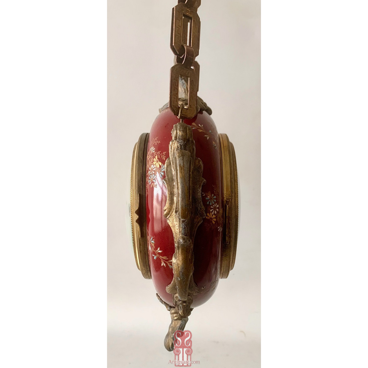 Reloj colgante de doble esfera de principios del Siglo XX.