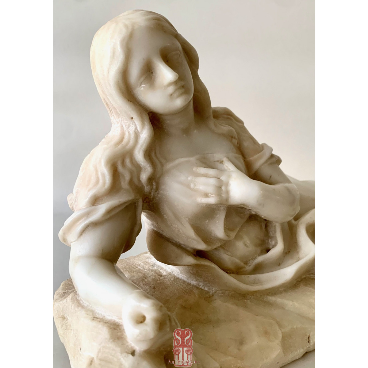 Magdalena penitente,  mármol blanco del siglo XVIII.
