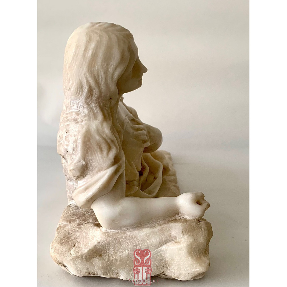 Magdalena penitente,  mármol blanco del siglo XVIII.