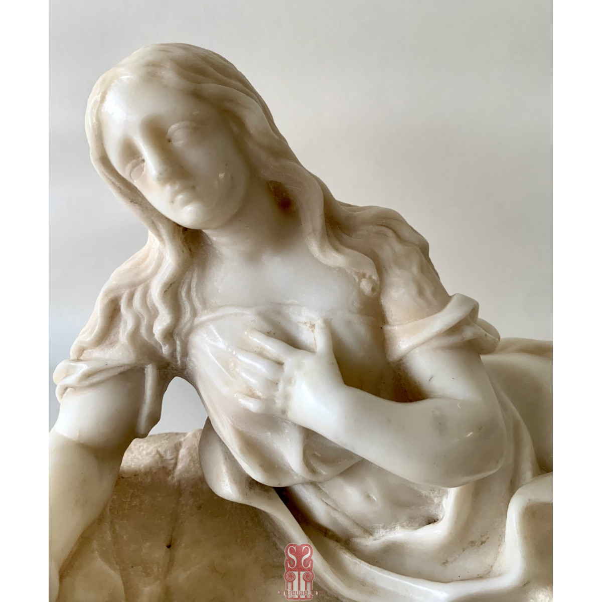 Magdalena penitente,  mármol blanco del siglo XVIII.