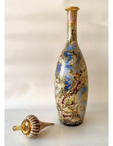 Art Nouveau glass bottle, decorated with decorative bird motifs enameled